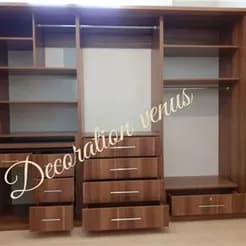 معدن کاران در بلوار فردوس و سازمان برنامه، کارگاه کابینت سازی دارد.
 - تصویر 2